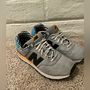 New Balance Gray Sneakers with Black and Orange Highlights